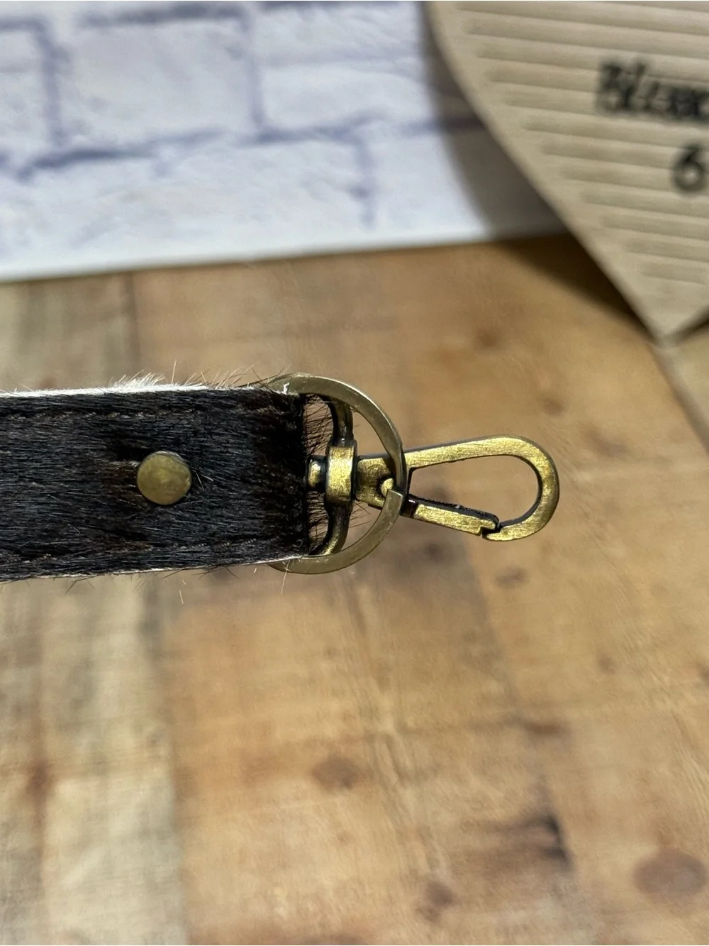 keychain hair-on-hide cowhide strap paired with a brass hook